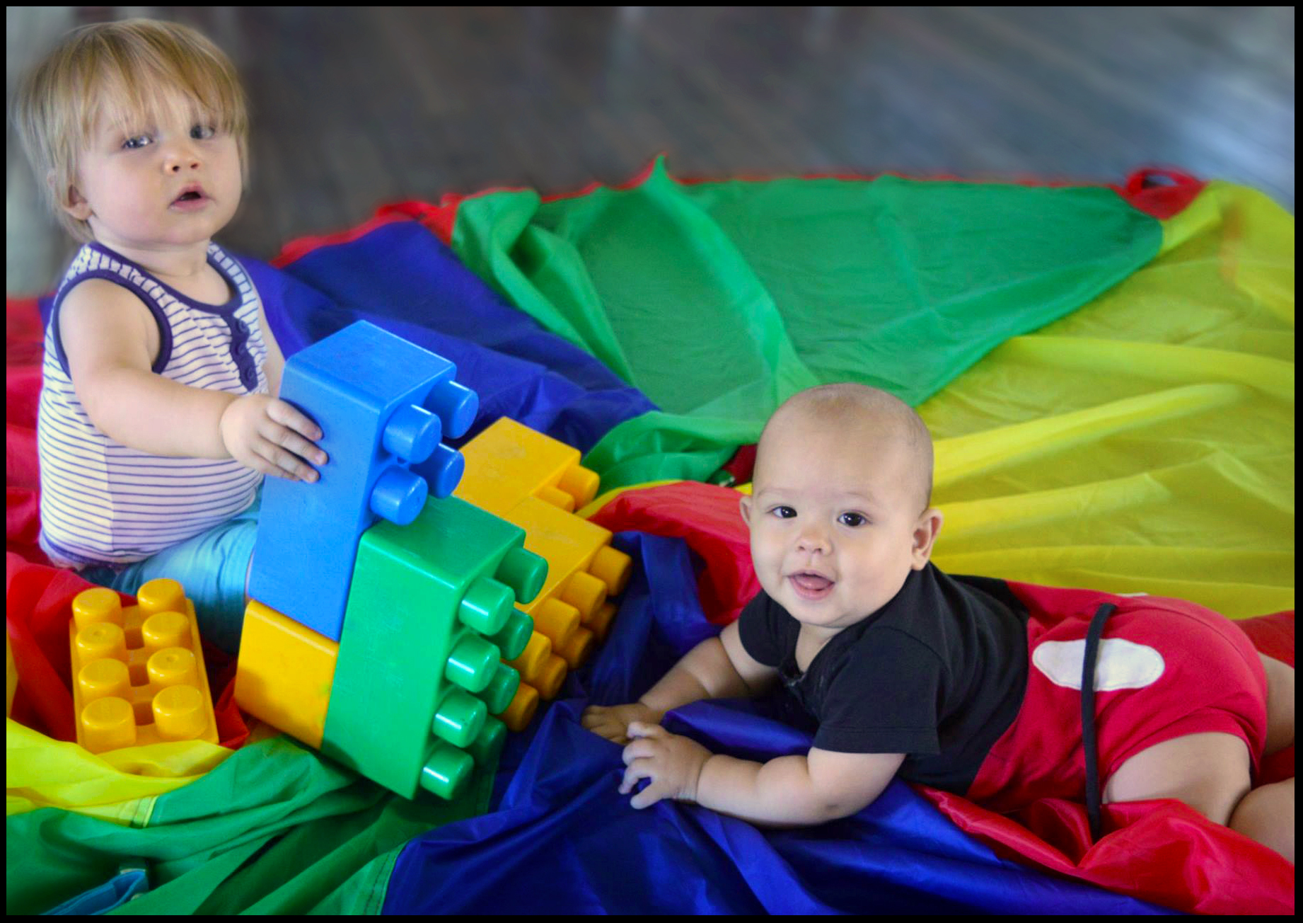 Young participants living with an Autism Spectrum Disorder (ASD) are smiling whilst engaging in our colourful, sensory class.
